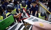 HK police dismantle protest barriers, reopen major road