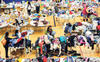 Evacuees from the Fort McMurray wildfires look through donated goods and clothing at the “Bold Center” in Lac la Biche, Alberta, Canada, May 5, 2016
