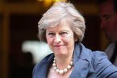 May announces Brexit deal means UK must leave EU single market...