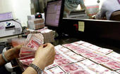 China cuts growth target for 2017 to 6.5%...