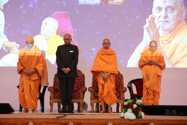 stage guests observing 1 minutes silence