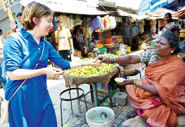 German lady on a bicycle, riding around the streets of Ulsoor selling potato salad 3