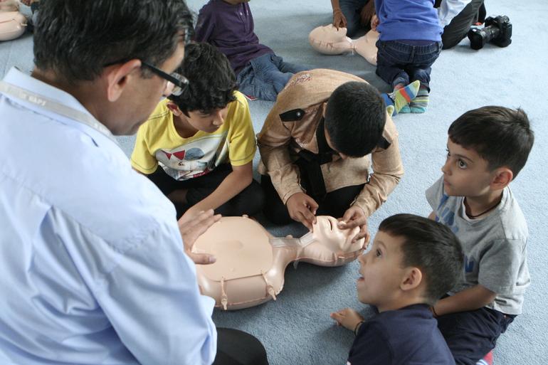 COMMUNITY HEALTH FAIR -- Kids learning CPR