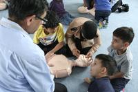 COMMUNITY HEALTH FAIR -- Kids learning CPR COMMUNITY HEALTH FAIR -- Kids learning CPR
